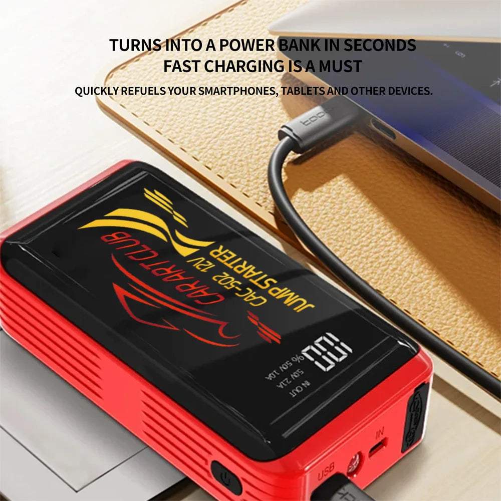 2026 New Smart Jump Starter in a red and black casing with a digital display, connected by USB cable to a tablet