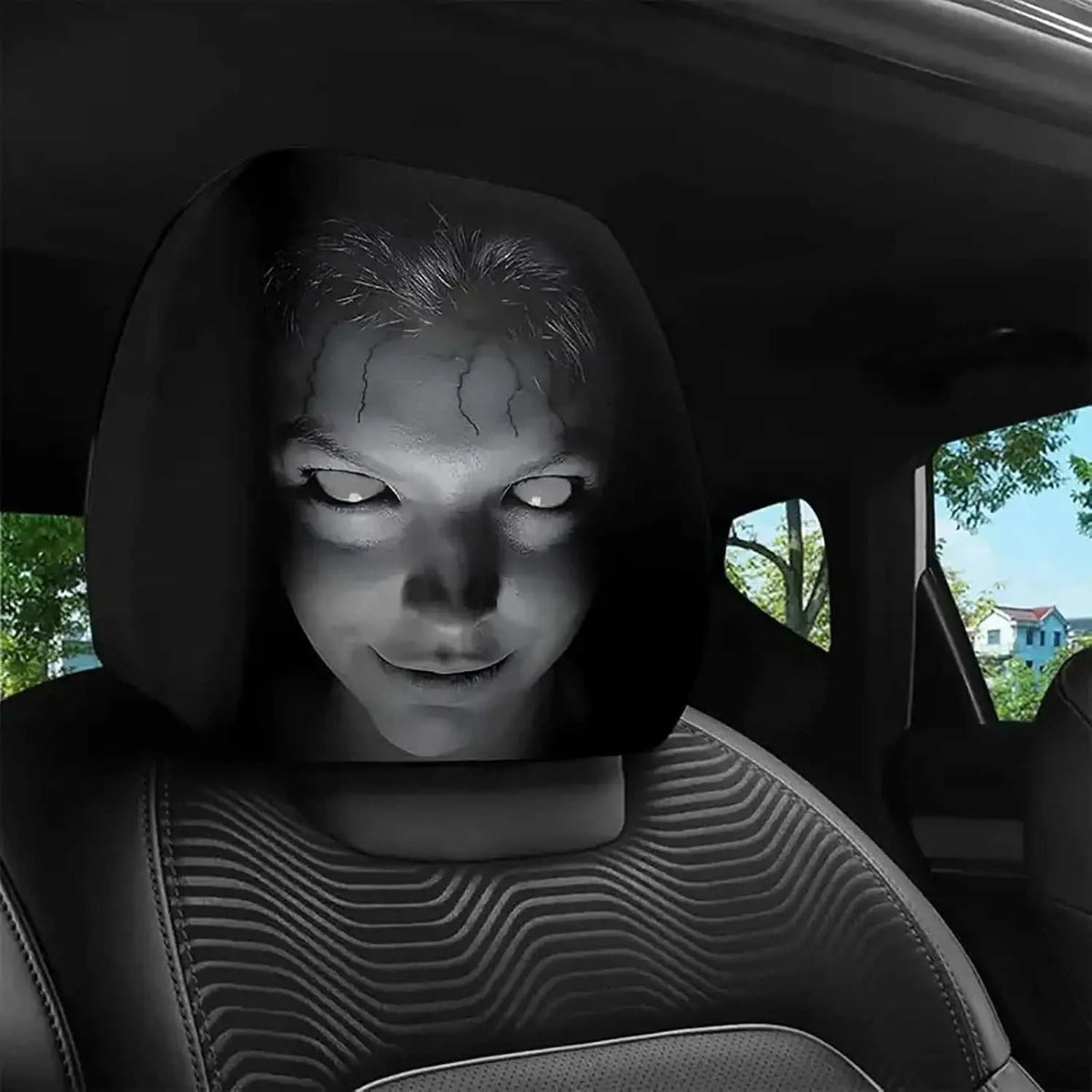 2Pcs Horror Design Car Headrest Covers in black polyester, printed with a pale, cracked-face horror figure with glowing white eyes