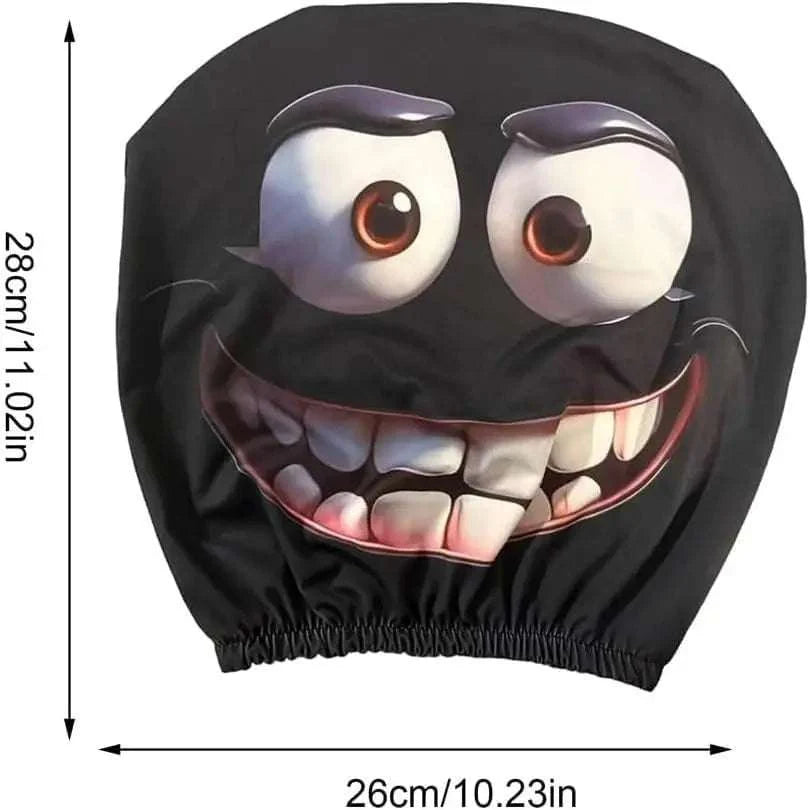 2PCS Universal Fit car headrest cover in black polyester with a large funny cartoon face, bulging eyes and grinning teeth