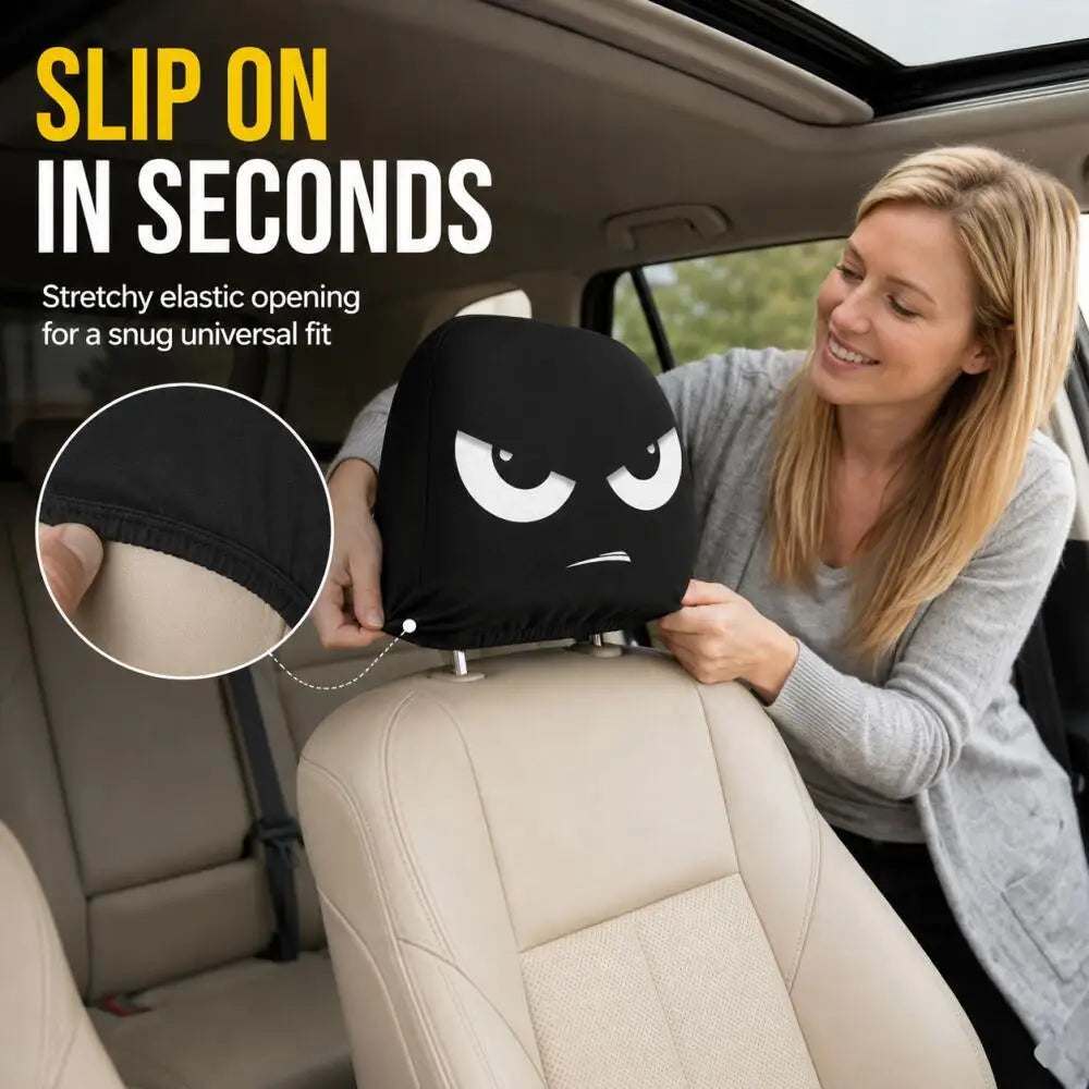 2PCS White Crooked Slant Eyes car headrest cover in black fabric, printed with bold white angry eyes and a small frown