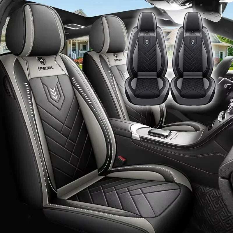 All inclusive seat cover in black and gray leather with quilted panels, contrast piping, and full seat coverage