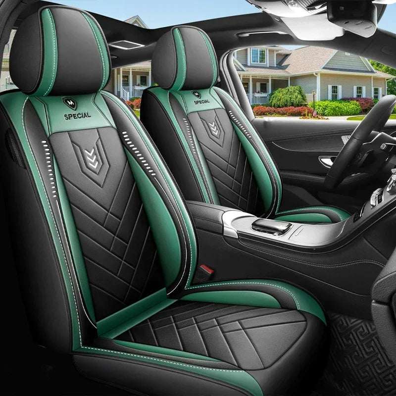 All inclusive seat cover in black and green leather-look material with quilted panels, contrast piping and headrest coverage