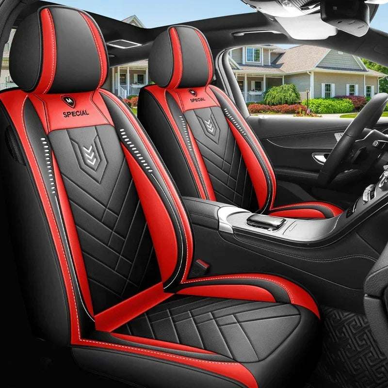 All inclusive seat cover in black and red leather-look material, with quilted panels, red piping and headrest coverage