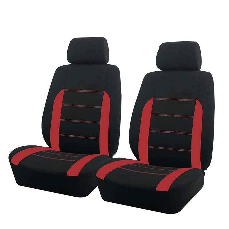 Car seat covers in black fabric with bold red side panels and stitched horizontal stripes, including matching headrest covers