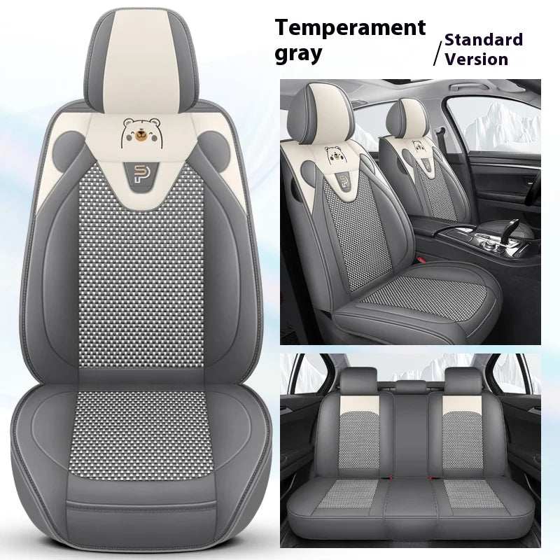 Five-Seat Car Seat Covers in gray and cream artificial leather, with patterned center panels and a small bear motif