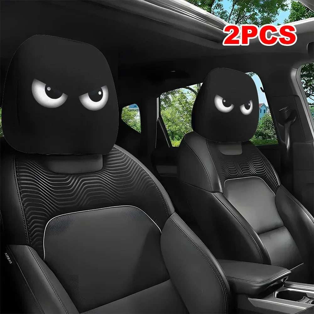 Funny Slanted Eyes black polyester car headrest covers with bold white cartoon eyes and a playful angry expression