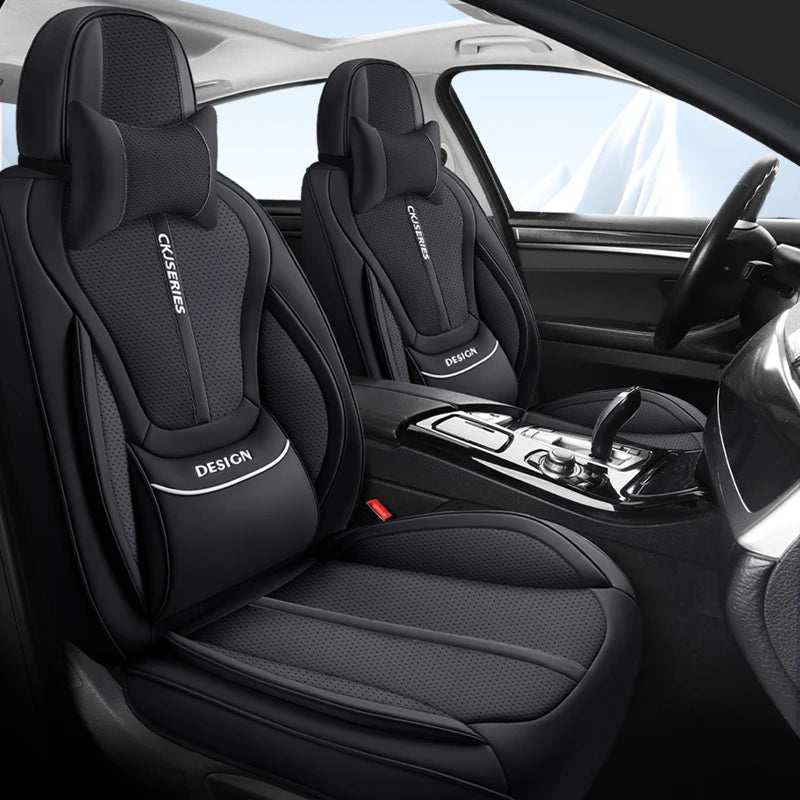 Premium PU Leather auto seat covers in black with perforated panels, padded lumbar support and matching headrest covers