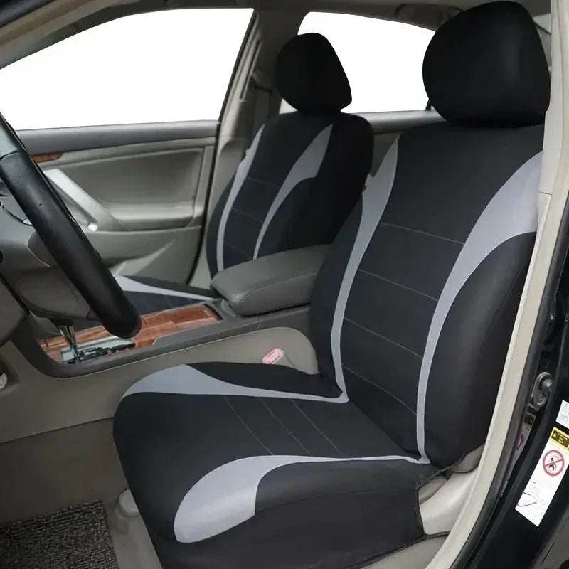 Seat Covers 9pcs Set in black and gray fabric with curved contrasting panels, fitted over car seats with headrests