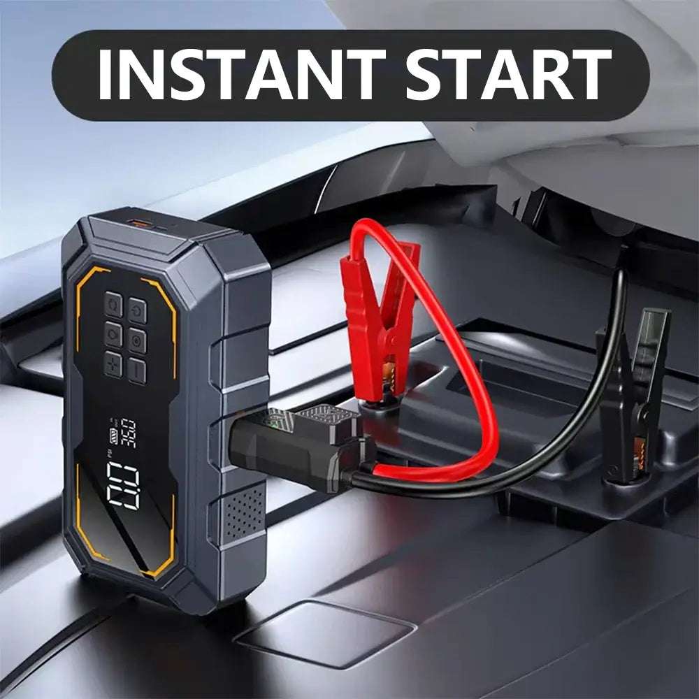 Vyvylabs Car Jump Starter, a black and gray portable battery with a digital display, connected to a car battery by red and black clamps.
